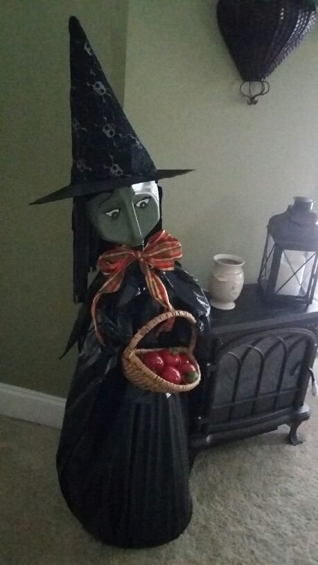 I love how this milk jug witch is made on top of a tomato cage covered with a black trash bag