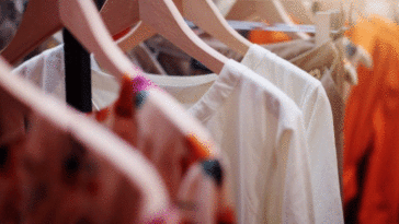 Photograph of clothes hanging on hangers