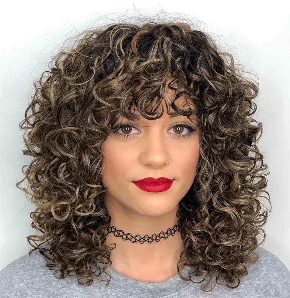 curly hair streaked with bangs