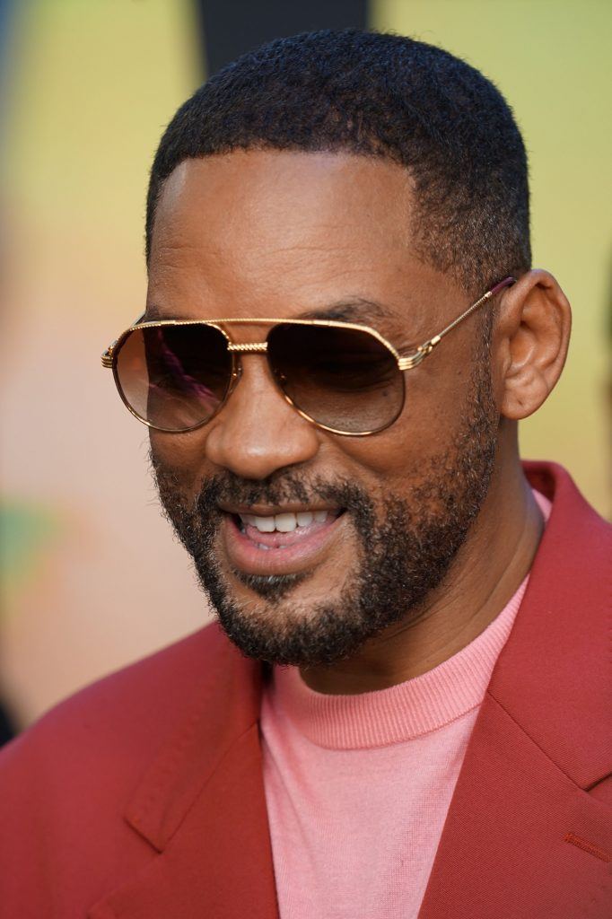 will smith with glasses and smiling with faded haircut