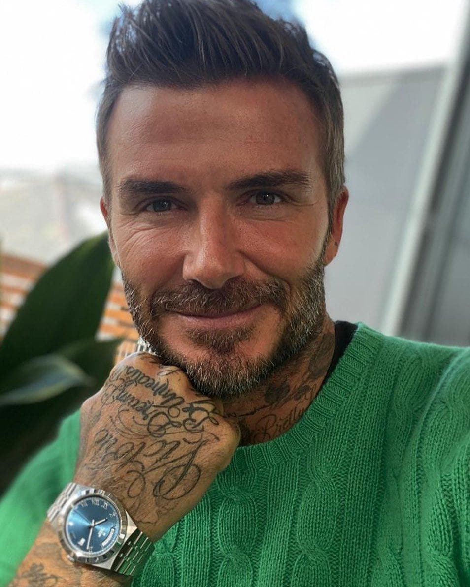 David Beckham with short male hair with shaved sides and light volume on top