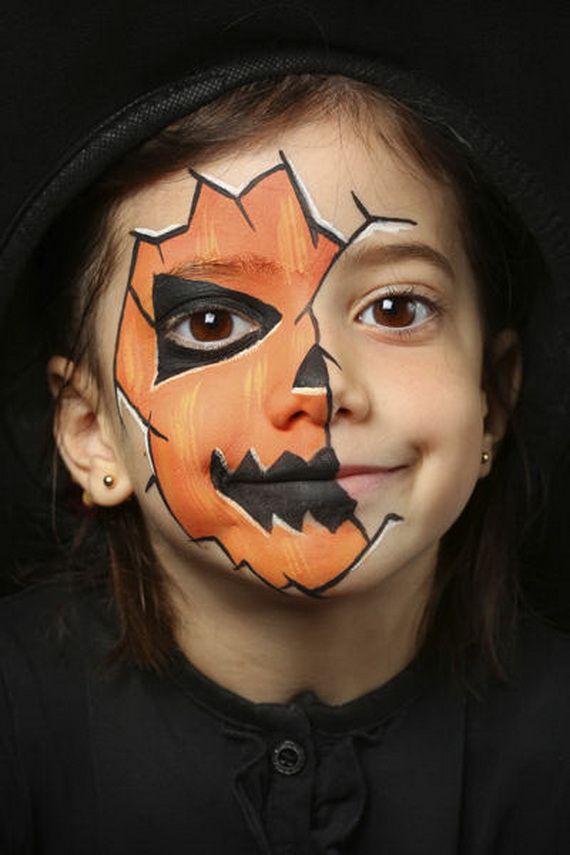 child with pumpkin makeup