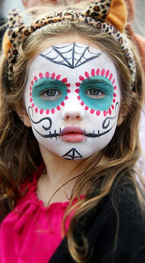 child with mexican skull makeup