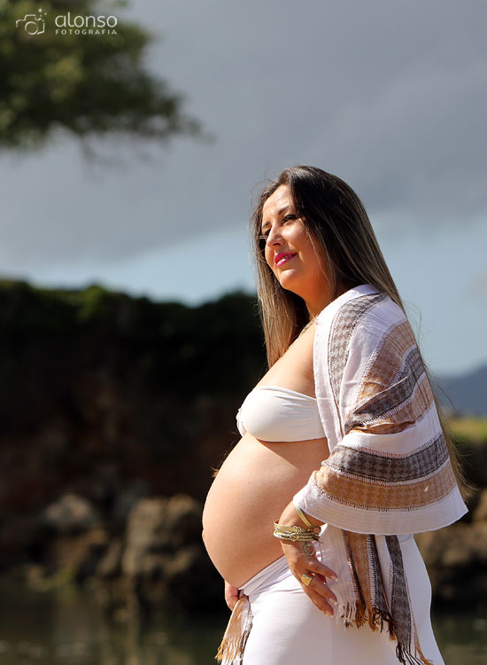 Pregnant woman white skirt, white top and shawl