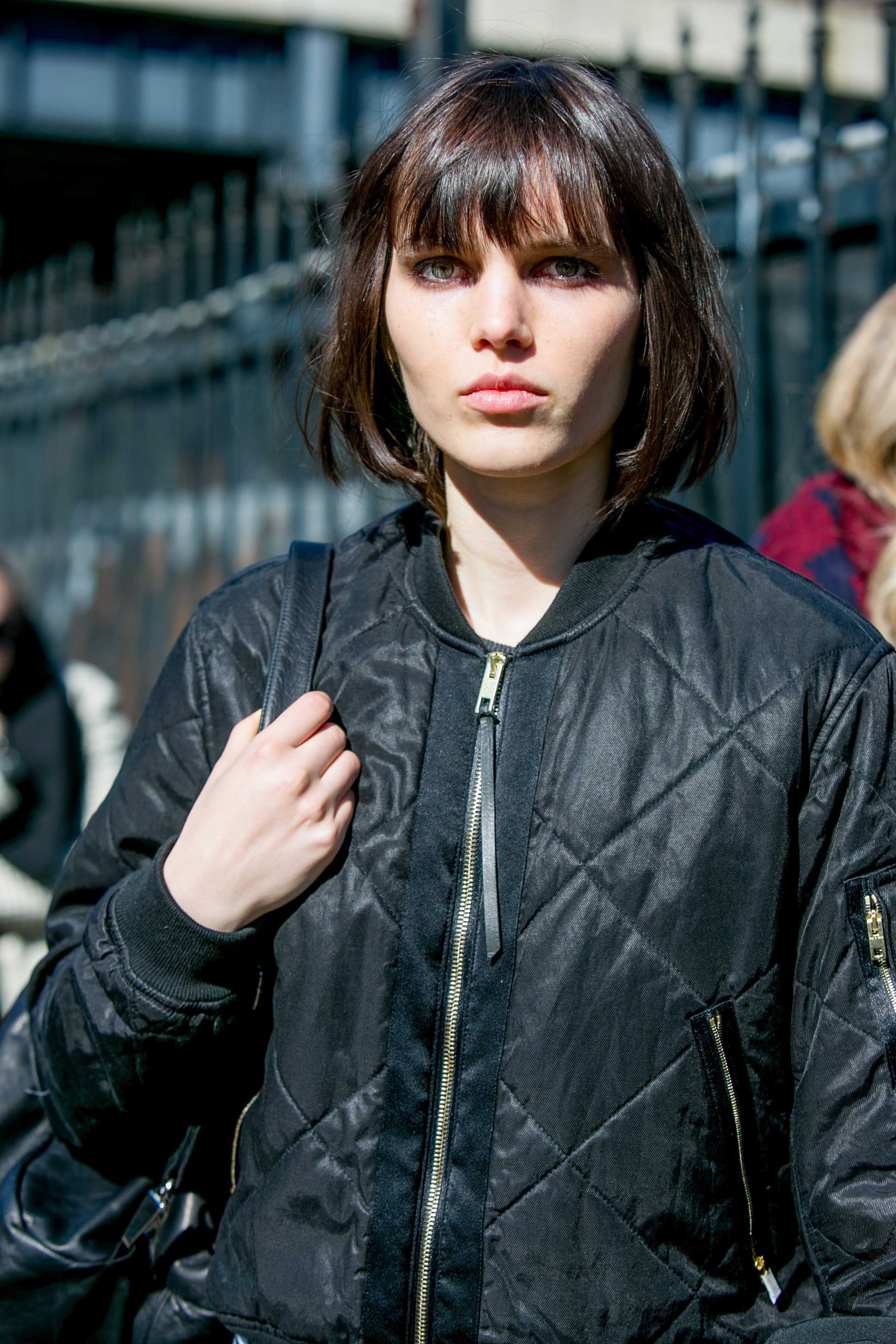 Model with brown hair, chanel with bangs and square face