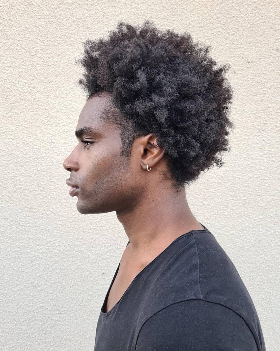 Man with black power hair for triangular face