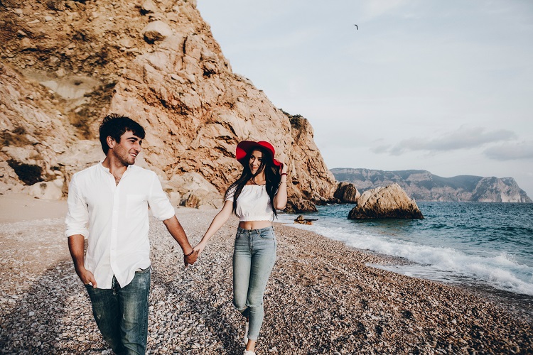 couple walking hand in hand on the beach, romantic phrases