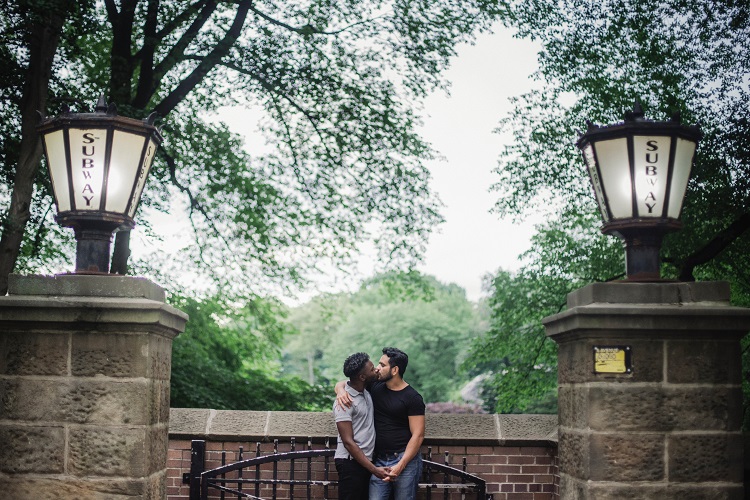 couple kissing on stone wall, romantic captions