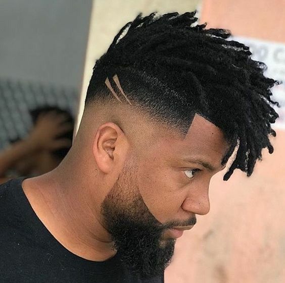 black male with dreads and Side zero male haircut 