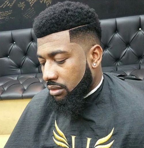 Black man in barbershop with male haircut 2021 line up
