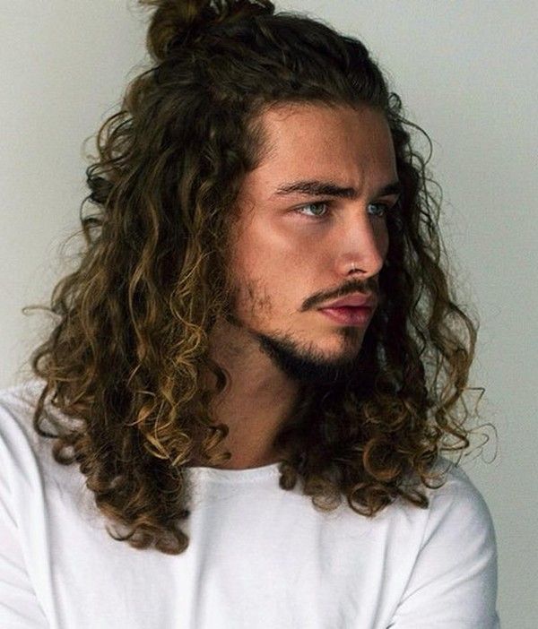 Man with long hair and messy waves men's cut 