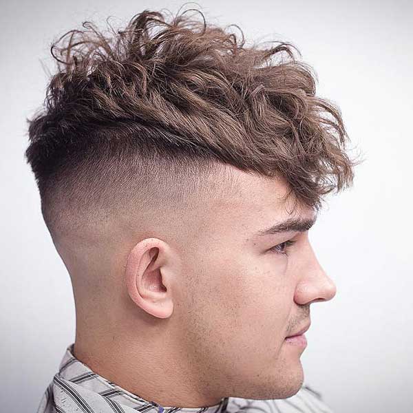 Undercut with peaked top and forward hairstyle