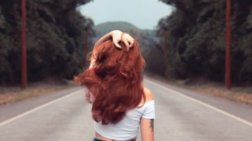 tumblr photo of redhead girl, from the back, holding her hair