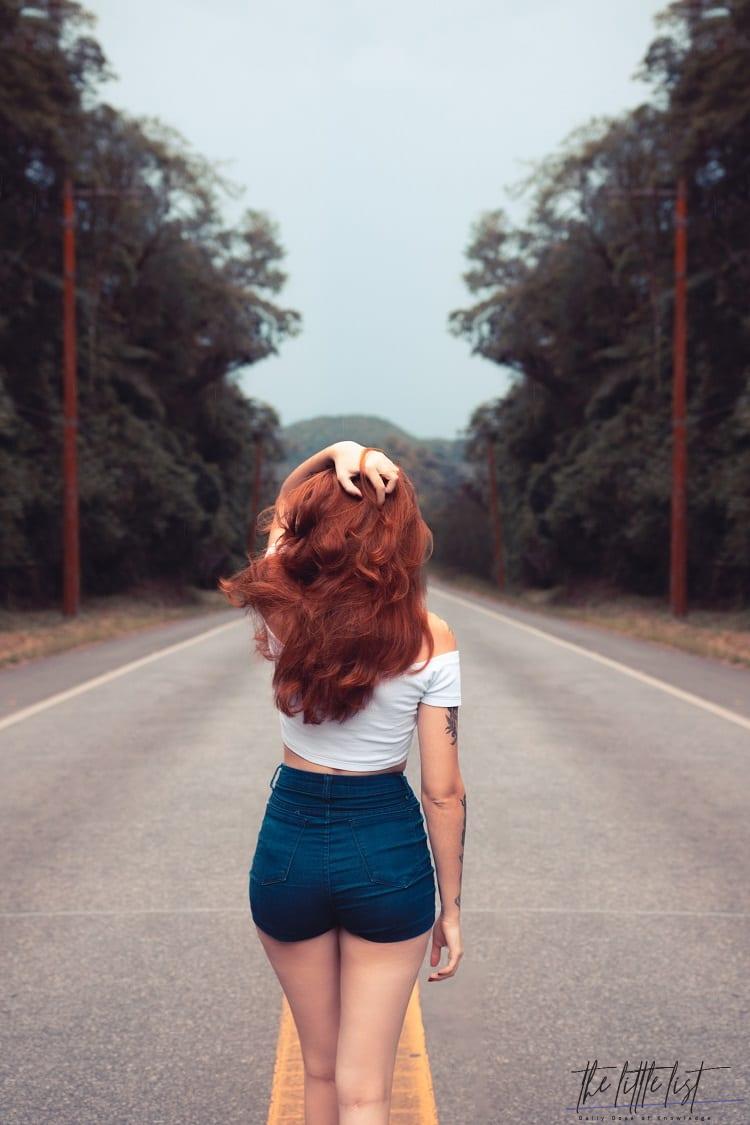 tumblr photo of redhead girl, from the back, holding her hair