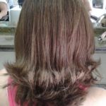 Cut short hair with peaks at the ends
