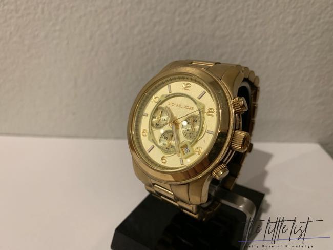 Does Michael Kors own Versace?