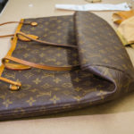 What causes Louis Vuitton canvas to crack?