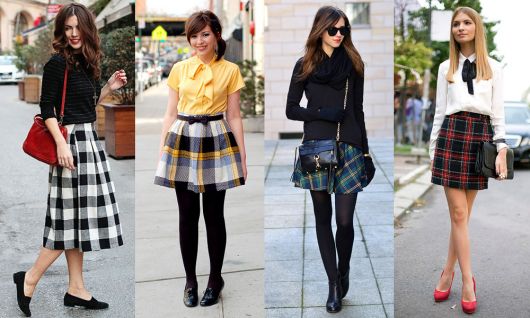 Model wears short plaid skirt with sock and blouse.