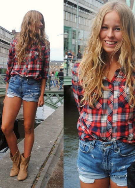 Model wears denim shorts, a plaid shirt and flesh-colored boots.