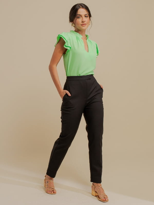 Women's clothes for work: model with tailored black twill pants.