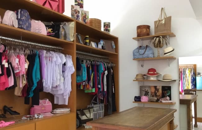 small clothing store with wooden furniture