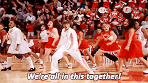 High School Musical scene where they sing We Are All In This Togheter;  students are in a gym dancing in white and red clothes.