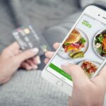 How do customers pay for Uber Eats?