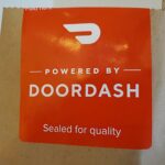 How does DoorDash decide who gets orders?