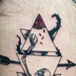 What does triangle tattoo symbolize?