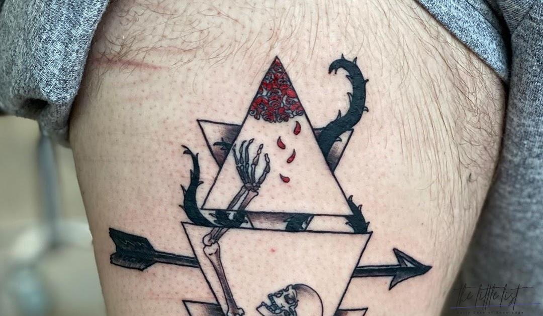 What does triangle tattoo symbolize?